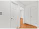 Hallway with hardwood floors and multiple doorways at 862 Mcalway Rd, Charlotte, NC 28211