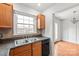 Eat-in kitchen with wood floors, stainless appliances, and natural light at 862 Mcalway Rd, Charlotte, NC 28211
