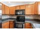Well-maintained kitchen with stainless steel appliances and wooden cabinets at 862 Mcalway Rd, Charlotte, NC 28211