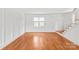 Bright and open living room featuring hardwood floors, large windows, and a staircase at 862 Mcalway Rd, Charlotte, NC 28211