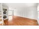 Hardwood floors, white walls and laundry closet define this expansive living room space at 862 Mcalway Rd, Charlotte, NC 28211