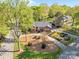 A beautiful aerial view of a home with a landscaped yard and circular driveway at 961 Confederate Ave, Salisbury, NC 28144