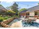 A stone patio provides the perfect place for grilling and outdoor gatherings with a water feature at 961 Confederate Ave, Salisbury, NC 28144