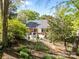 The backyard features a stone patio with room for grilling and outdoor seating at 961 Confederate Ave, Salisbury, NC 28144