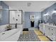 A stylish bathroom featuring a standalone tub, walk-in shower, and dual vanities at 961 Confederate Ave, Salisbury, NC 28144