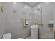 A stylish powder room with modern fixtures, unique pedestal sink, and decorative wall art at 961 Confederate Ave, Salisbury, NC 28144