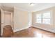 Bedroom with hardwood floors and natural light from the windows at 104 Willetta Dr, Charlotte, NC 28217