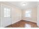 A calm bedroom space that features hardwood floors and bright natural light at 104 Willetta Dr, Charlotte, NC 28217