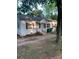 Charming single-story home with light colored exterior and ample front yard space at 104 Willetta Dr, Charlotte, NC 28217