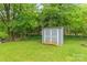 Durable storage shed nestled in a green lawn, providing ample storage space in the backyard at 104 Willetta Dr, Charlotte, NC 28217