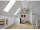 Bright attic space with hardwood floors, skylights and built in shelves and cabinets at 108 Stockton St, Shelby, NC 28150