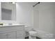 Clean bathroom with white fixtures including a bathtub, toilet, and vanity at 108 Stockton St, Shelby, NC 28150