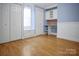 Bright bedroom featuring hardwood floors, built-in shelving, and a cozy window nook at 108 Stockton St, Shelby, NC 28150