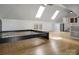 A well-lit attic bedroom featuring hardwood floors and two skylights at 108 Stockton St, Shelby, NC 28150