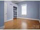 Bright bedroom showcases hardwood floors, closet space, and plenty of natural light at 108 Stockton St, Shelby, NC 28150