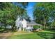 Charming home with a well-manicured front lawn and mature trees at 108 Stockton St, Shelby, NC 28150