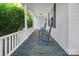 Relaxing front porch with rocking chairs, providing a peaceful spot to enjoy the outdoors at 108 Stockton St, Shelby, NC 28150