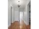 Bright hallway with hardwood floors and fresh white trim that leads into the house at 108 Stockton St, Shelby, NC 28150