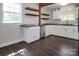 Bright kitchen with stainless steel appliances, tile backsplash, and hardwood floors at 108 Stockton St, Shelby, NC 28150