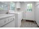 Laundry room featuring a washer, dryer, and cabinets at 108 Stockton St, Shelby, NC 28150