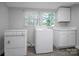 Laundry room with washer, dryer, and natural light at 108 Stockton St, Shelby, NC 28150