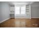 Inviting living room features custom built-ins, hardwood floors, and lots of natural light at 108 Stockton St, Shelby, NC 28150