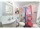 Bright bathroom featuring a vibrant shower curtain and a classic design at 1115 Grovewood Dr, Charlotte, NC 28208