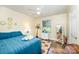 Serene bedroom featuring a comfortable bed, a ceiling fan, and natural light at 1115 Grovewood Dr, Charlotte, NC 28208