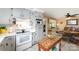 Well-lit kitchen with a view into the dining room and updated appliances at 1115 Grovewood Dr, Charlotte, NC 28208
