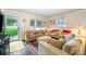 Bright living room featuring an abundance of natural light and hardwood floors at 1115 Grovewood Dr, Charlotte, NC 28208