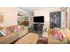 Comfortable living room with hardwood floors, a TV, and direct access to the front door at 1115 Grovewood Dr, Charlotte, NC 28208