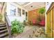 This patio has a charming small yard area with decorative plants at 1115 Grovewood Dr, Charlotte, NC 28208