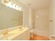 Bathroom with double sink vanity, large mirror, and shower over tub at 12314 Chickasaw Dr, Huntersville, NC 28078
