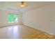 Bright and spacious bedroom with hardwood floors and ceiling fan at 12314 Chickasaw Dr, Huntersville, NC 28078