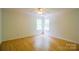 Bright bedroom with ceiling fan and natural light from two windows at 12314 Chickasaw Dr, Huntersville, NC 28078
