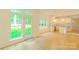 Open-concept living room flowing into kitchen with ample natural light at 12314 Chickasaw Dr, Huntersville, NC 28078