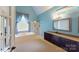Elegant bathroom with a soaking tub, separate shower, and stylish vanity, creating a serene retreat at 1337 Braeburn Nw Rd, Concord, NC 28027