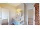 Bathroom with a double vanity, neutral walls and a view into a bedroom at 1337 Braeburn Nw Rd, Concord, NC 28027
