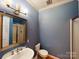 Full bathroom featuring a vanity, toilet, and glass shower at 1337 Braeburn Nw Rd, Concord, NC 28027
