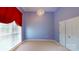 Bedroom featuring a hanging chandelier, blue walls, carpet, and a large window at 1337 Braeburn Nw Rd, Concord, NC 28027