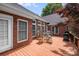 Beautiful deck featuring wood flooring, outdoor seating, and lovely brick home exterior at 1337 Braeburn Nw Rd, Concord, NC 28027
