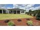 Manicured lawn and landscaping in the backyard, perfect for outdoor activities at 13605 Tranquil Day Dr, Matthews, NC 28105