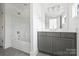 Bathroom features tub/shower combo, vanity, and tile floors at 13605 Tranquil Day Dr, Matthews, NC 28105