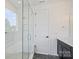Stylish bathroom featuring a glass-enclosed shower with tiled walls and a modern vanity at 13605 Tranquil Day Dr, Matthews, NC 28105