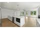 Kitchen and Living Room Combo featuring a large island, stainless appliances, fireplace, and hardwood floors at 13605 Tranquil Day Dr, Matthews, NC 28105