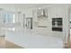 Modern kitchen featuring an island, stainless appliances, and stylish backsplash at 13605 Tranquil Day Dr, Matthews, NC 28105