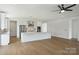 Modern kitchen featuring stainless steel appliances, an island, and pendant lighting at 13605 Tranquil Day Dr, Matthews, NC 28105