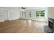 Spacious living room boasting hardwood floors, large windows, and neutral paint at 13605 Tranquil Day Dr, Matthews, NC 28105