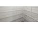Organized walk-in pantry featuring metal shelving for ample storage space at 13605 Tranquil Day Dr, Matthews, NC 28105