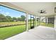 Covered porch featuring ceiling fan and views of the landscape at 13605 Tranquil Day Dr, Matthews, NC 28105